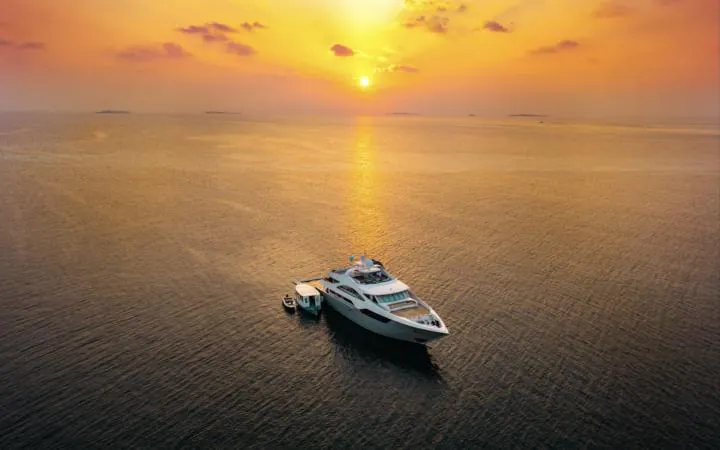 Yacht on a calm sea at sunset